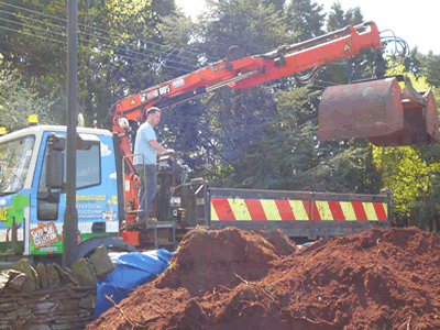 grab truck collecting soil